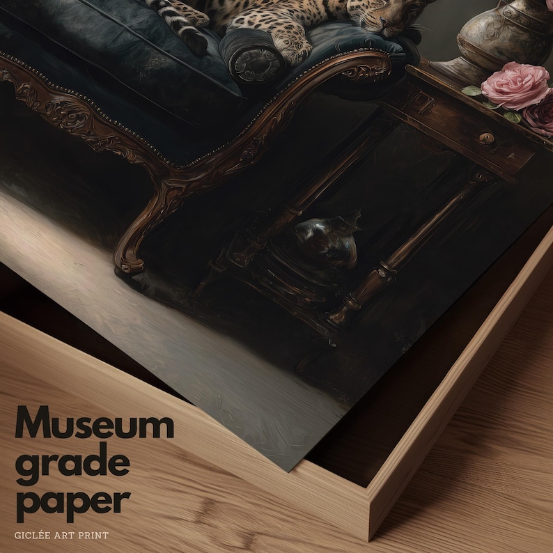 May include: A framed art print depicting a leopard on a dark blue chaise lounge. The artwork is presented in a wooden frame, with the text "Museum grade paper" and "GICLEE ART PRINT" visible on the front of the print.
