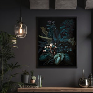 May include: A framed print of a dark green and black floral arrangement with white flowers. The print is hanging on a dark gray wall with a black pendant light above it.