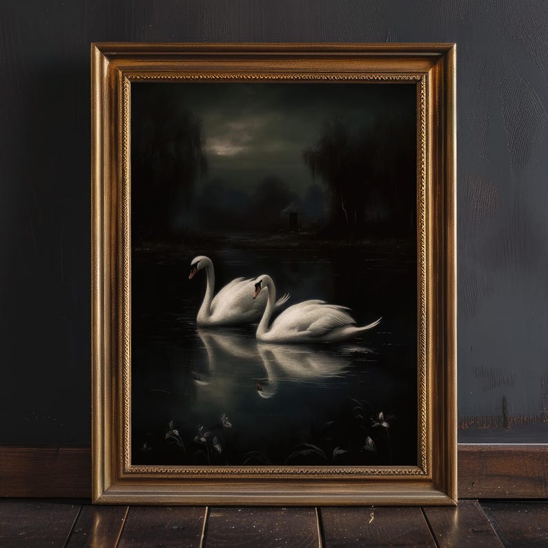 May include: A framed oil painting depicting two white swans swimming in a dark, still lake. The swans are facing each other, with their necks curved and their heads tilted. The background is a dark forest with a faint moon in the sky.