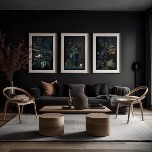 May include: Three framed botanical prints with dark green and black floral arrangements in a dark room with a black sofa, two wooden chairs, and a wooden coffee table with two wooden stools.