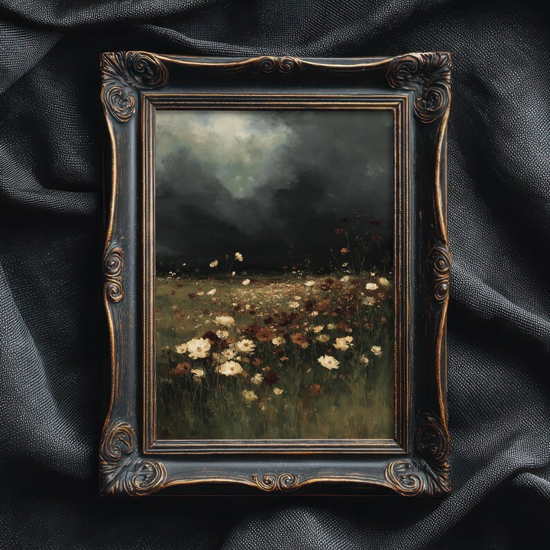 May include: An antique-style framed painting depicts a field of wildflowers under a dark, cloudy sky. The painting features a variety of white and brown flowers in a grassy field. The ornate, dark-colored frame adds a vintage aesthetic to the artwork.