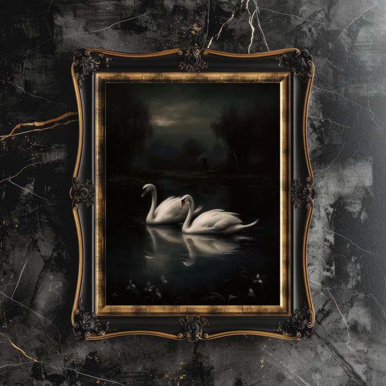 May include: A framed painting of two white swans swimming in a dark, still lake. The swans are in the foreground, with a dark forest in the background. The painting is in a black frame with gold accents.