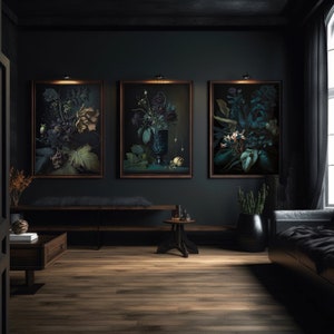 May include: Three framed botanical prints with dark green leaves and flowers in a dark room with a wooden floor, a bench, and a small table.