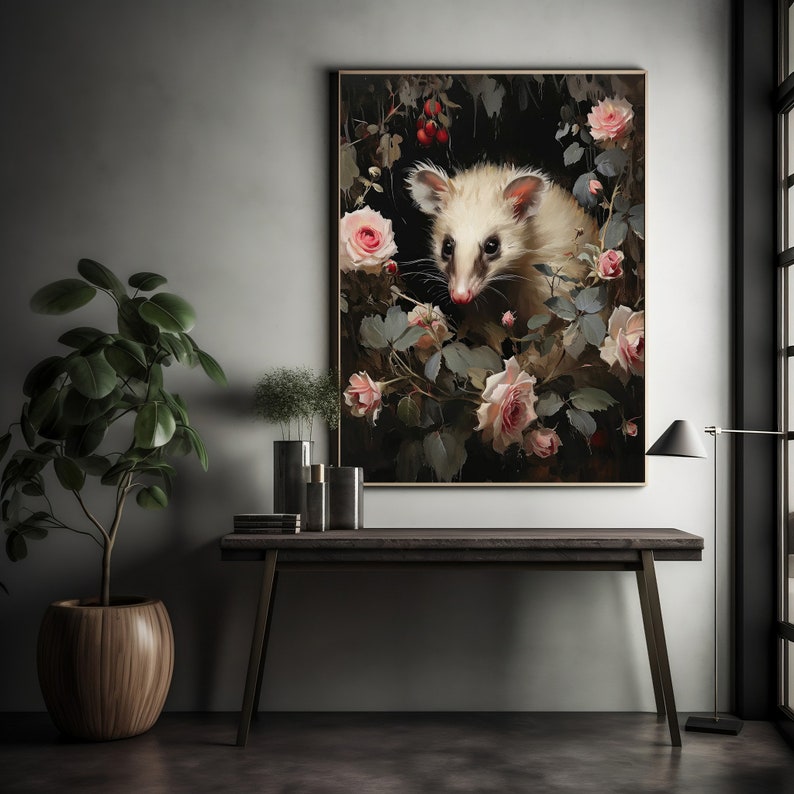 May include: A framed art print featuring a possum surrounded by pink roses and foliage. The artwork has a dark background with a vintage aesthetic. The possum has white fur and dark eyes, adding a touch of wildlife to the floral arrangement.