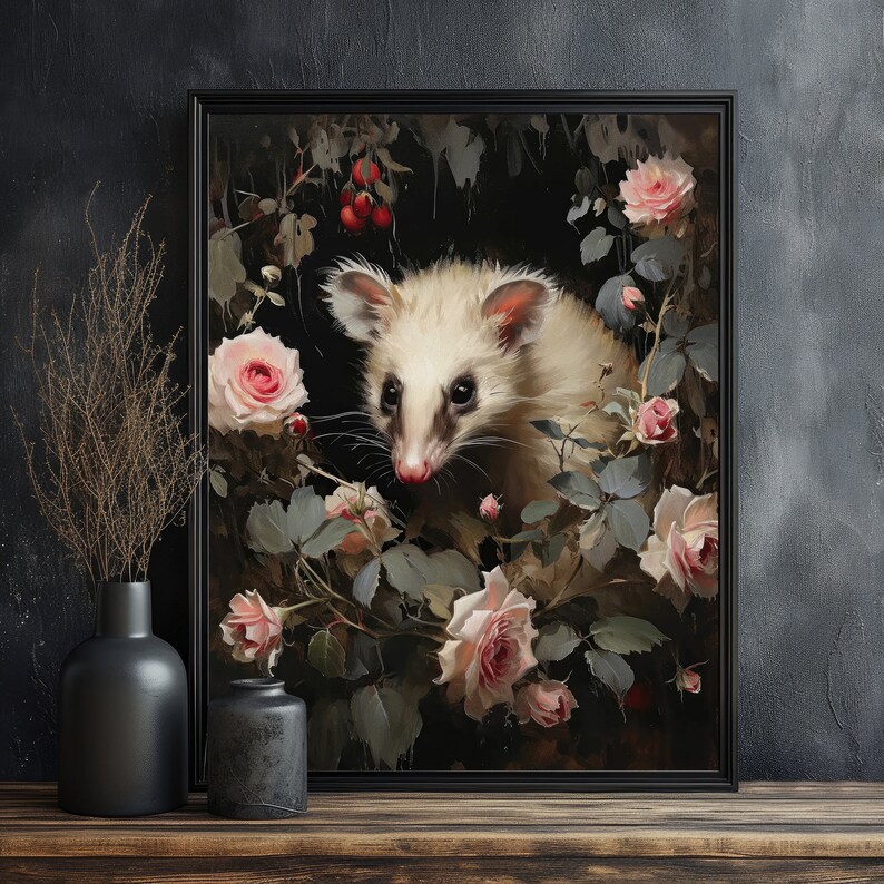May include: Framed art print featuring a white opossum surrounded by pink roses and foliage. The artwork has a dark, moody aesthetic with a black frame. The opossum has a pink nose and ears, and the roses are in full bloom.