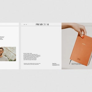 May include: A close-up of a brown leather bound journal with gold lettering that reads "HELLO JOURNAL" and "2023". The journal is being held by a hand with orange nail polish.
