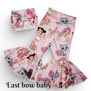 May include: Pink baby pants and matching headband set. The set features a repeating pattern of cartoon characters and blue cats. The pants have a flared leg design. The text "East bow baby" is at the bottom of the image.