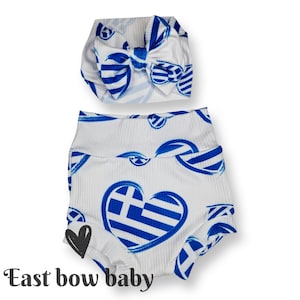 May include: White baby bloomers with a blue and white Greek flag heart pattern. A matching blue and white Greek flag heart headband is included.