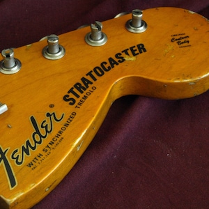 Two Vintage and Reproduction Guitar Headstock Waterslide Decals  Real Metallic Gold and Black inks. Two per order Strats and Teles!