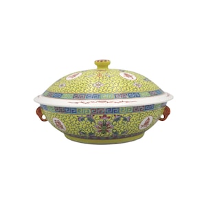 May include: A yellow ceramic serving bowl with a lid, decorated with floral and geometric patterns in red, blue, and green. The bowl has two small handles and a decorative knob on the lid. The design is a traditional Asian style.