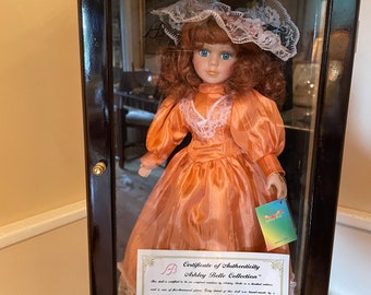 Ashley Belle Porcelain Doll Orange Satin Dress Lace Bonnet