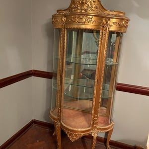 Victorian Wood Gilded Glass Display Cabinet Curved Glass Antique Showcase Shelves Gold Trimmed Curio Cherub Home Decor Elegant Accent Piece