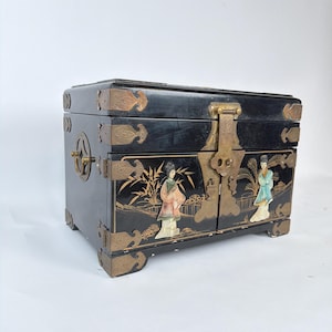 May include: A rustic wooden sign with the text "Welcome to our home" in white lettering. The sign features a distressed finish and a simple, inviting design, perfect for a front porch or entryway.