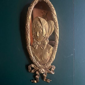 Vintage Gold Tone Wall Plaque Oval Portrait of Woman in Bonnet Victorian Style Embossed Decorative Hanging Art Home Accent Ribbon Detail