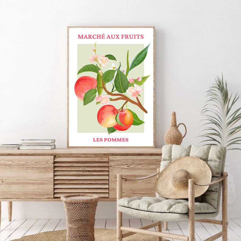 May include: A vintage-style poster with a green background featuring a branch of apple blossoms and red apples. The text "MARCH&Eacute; AUX FRUITS" and "LES POMMES" is printed in pink.