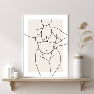 May include: Line art drawing of a person in a swimsuit. The drawing is in black and white and is on a beige background.