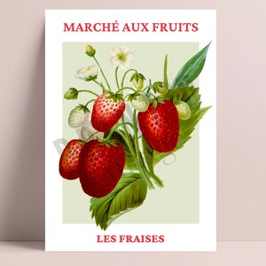 May include: A vintage illustration of a bunch of red strawberries with green leaves and white flowers. The text "MARCH&Eacute; AUX FRUITS" and "LES FRAISES" is printed in red.
