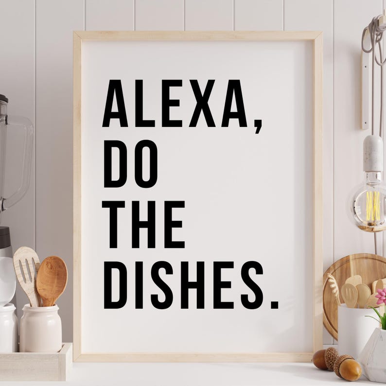 May include: A white framed print with black text that reads "ALEXA, DO THE DISHES."