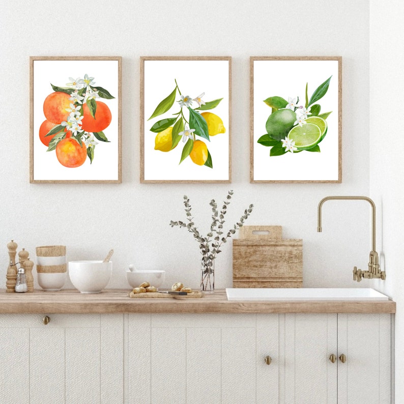 May include: Three framed watercolor prints of citrus fruit with blossoms. The prints feature oranges, lemons, and limes.