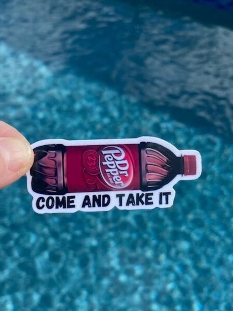 May include: A white sticker with a red and black Dr Pepper bottle graphic and the text "Come and Take It".