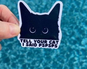 May include: White sticker with a black silhouette of a cat's head and the text "Tell your cat I said pspsps".