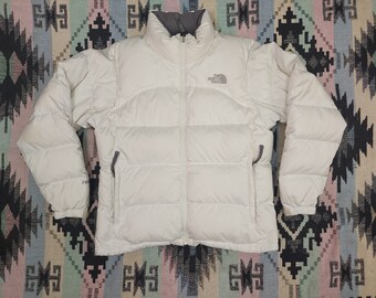 white puffy north face jacket