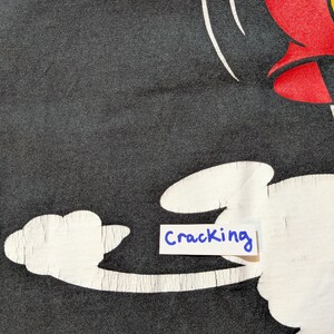 May include: A white ceramic mug with a black handle and the text "But First, Coffee" in a black, bold font. The mug is on a white surface. The mug is 10 cm tall.