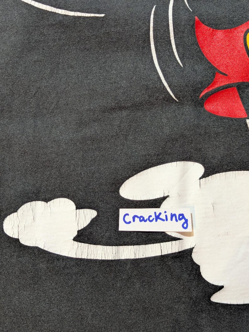 May include: A white ceramic mug with a black handle and the text "But First, Coffee" in a black, bold font. The mug is on a white surface. The mug is 10 cm tall.