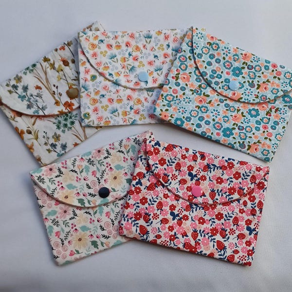Small flower pouch/sequined border inside, storage for papers/cards, tissues, personal protection, keys, headphones, storage, gift