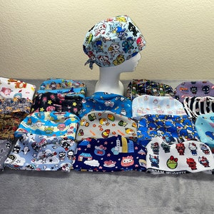 May include: A collection of 17 colorful surgical scrub caps with various cartoon and anime character designs. The caps are made of soft, breathable fabric and feature adjustable ties for a comfortable fit.