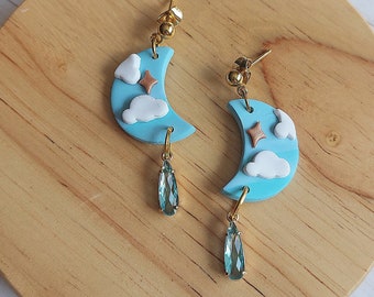 Moon shaped clay earrings with sky design and blue crystal drop accent