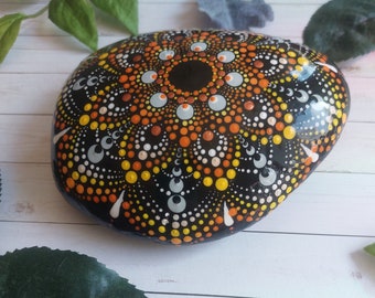 Real rock mandala stone, black orange grey yellow sacred geometry stone