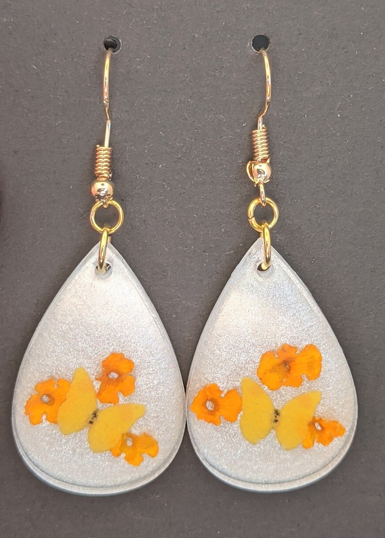 Yellow butterfly and real dried orange lantana flower teardrop resin earrings with gold plated French hooks