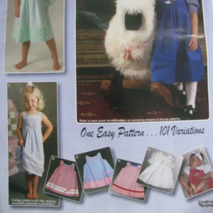 May include: A pattern for making children's dresses with 101 variations. The pattern includes a variety of styles, including a blue dress with white embroidery, a pink dress with white trim, and a white dress with lace. The text "One Easy Pattern... 101 Variations" is printed on the page.