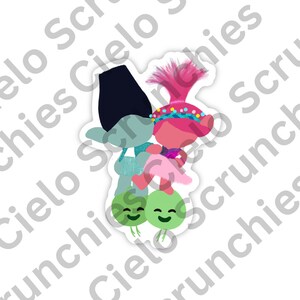 May include: A sticker featuring two cartoon trolls, one blue and one pink, standing on top of two green, smiling, mushroom-like characters.