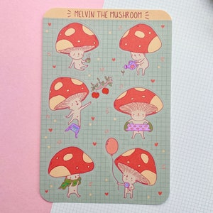 Peut inclure: Une feuille d'autocollants illustrant des champignons rouges et blancs avec différentes expressions et activités. Les autocollants sont sur un fond vert avec un motif de grille et le texte "Melvin the Mushroom" en haut.