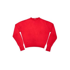 May include: A solid red sweater with long sleeves and a crew neck. The sweater has ribbed cuffs and a ribbed hem. The fabric appears to be a knit material. The sweater is displayed on a white background.