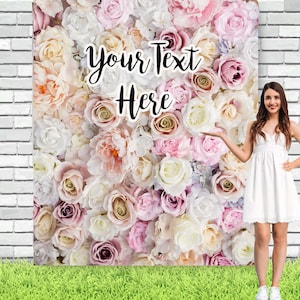 May include: A backdrop featuring a wall of pink, white and cream roses. The text "Your Text Here" is written in black on the wall of flowers.