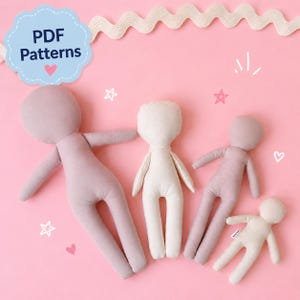 May include: Four soft fabric dolls in varying sizes arranged on a pink background. The dolls are made of plain, unadorned textile material in shades of dusty rose and cream. A blue scalloped label in the top left corner displays the text PDF Patterns.