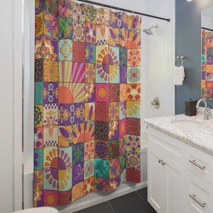 May include: A colorful shower curtain with a patchwork design. The curtain features squares with floral, sunburst, and geometric patterns in shades of orange, purple, teal, and red. The curtain is hanging in a bathroom.