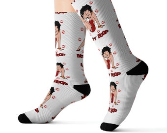 May include: White socks with a repeating pattern of Betty Boop in a red dress with the text "Betty Boop" on the socks.