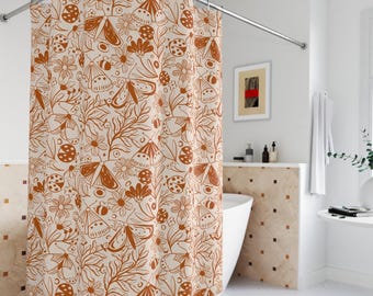 May include: A shower curtain with a white background and a brown pattern of butterflies, flowers, and ladybugs.