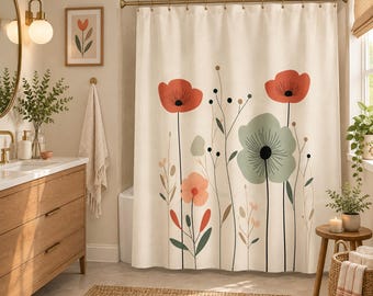 May include: A cream-colored shower curtain featuring a botanical print of stylized flowers in shades of red, sage green, and soft peach. The design includes thin black stems and delicate line-drawn foliage, suspended from a gold-toned metal rod.
