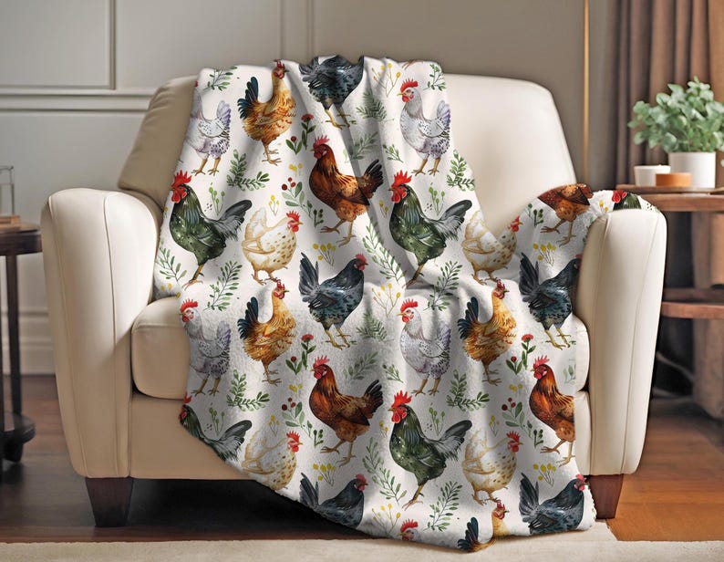 May include: A white throw blanket with a repeating pattern of colorful chickens and green foliage. The chickens are in various poses, including standing, walking, and pecking.
