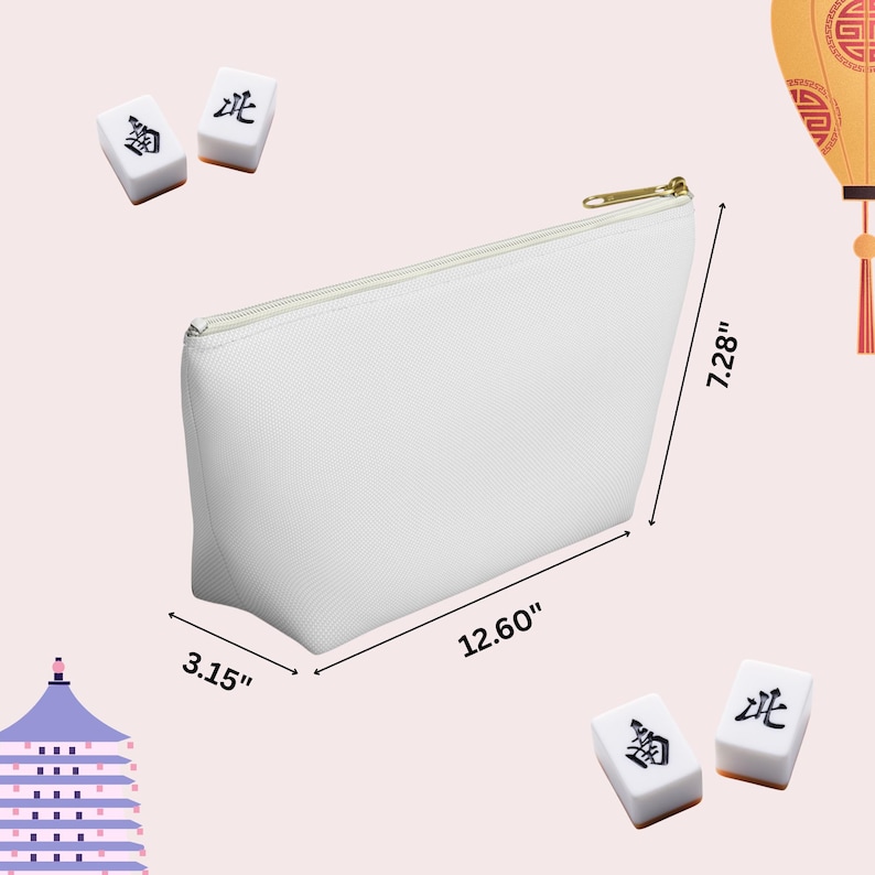 May include: A white zippered pouch, 32 cm long, 18.5 cm high, and 8 cm wide, with a gold zipper. Two Mahjong tiles are placed near the pouch. The background is a light pink with a decorative lantern.