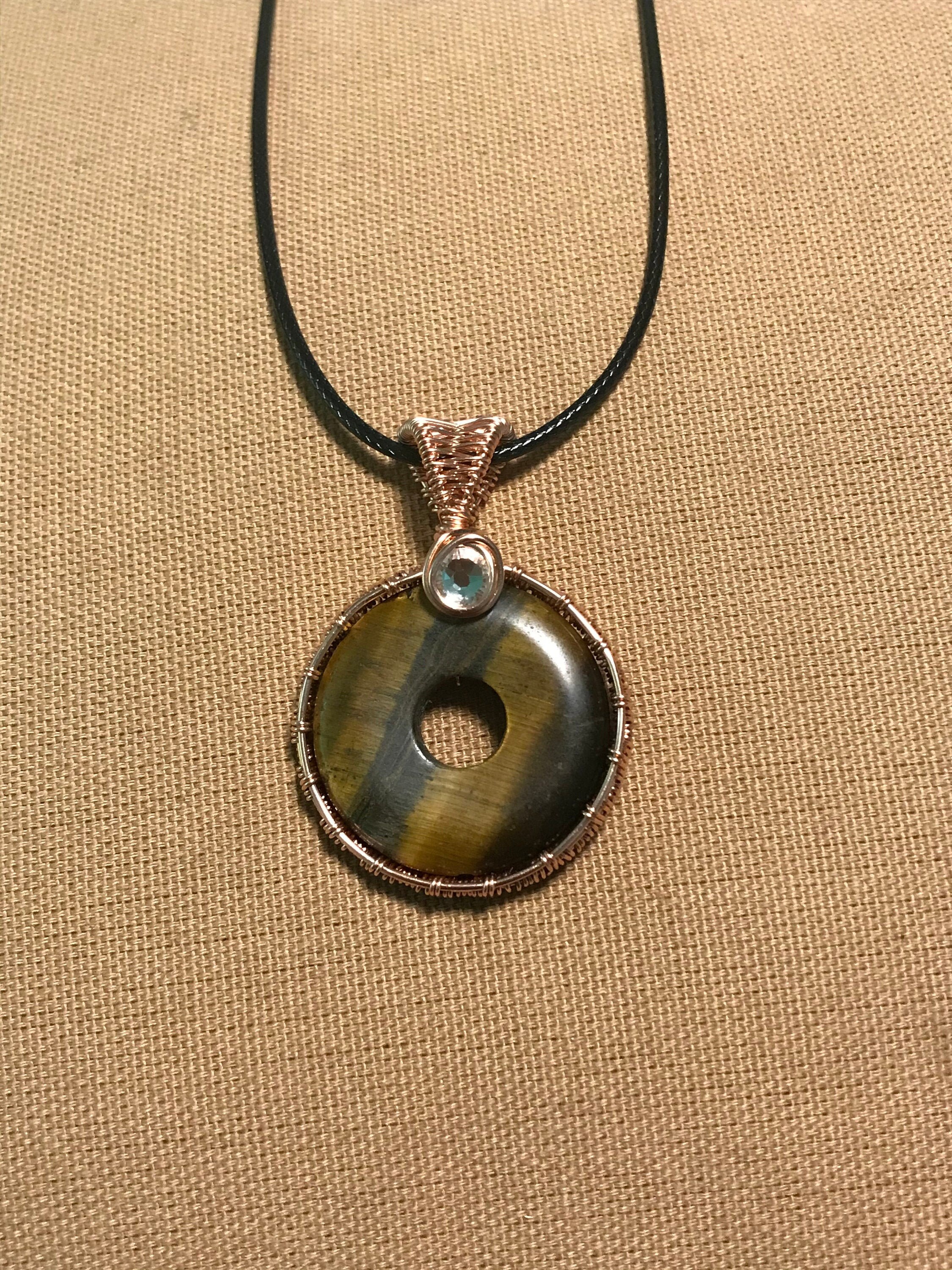 Tigers eye wirewrapped copper pendant with swavorski crystal / Etsy