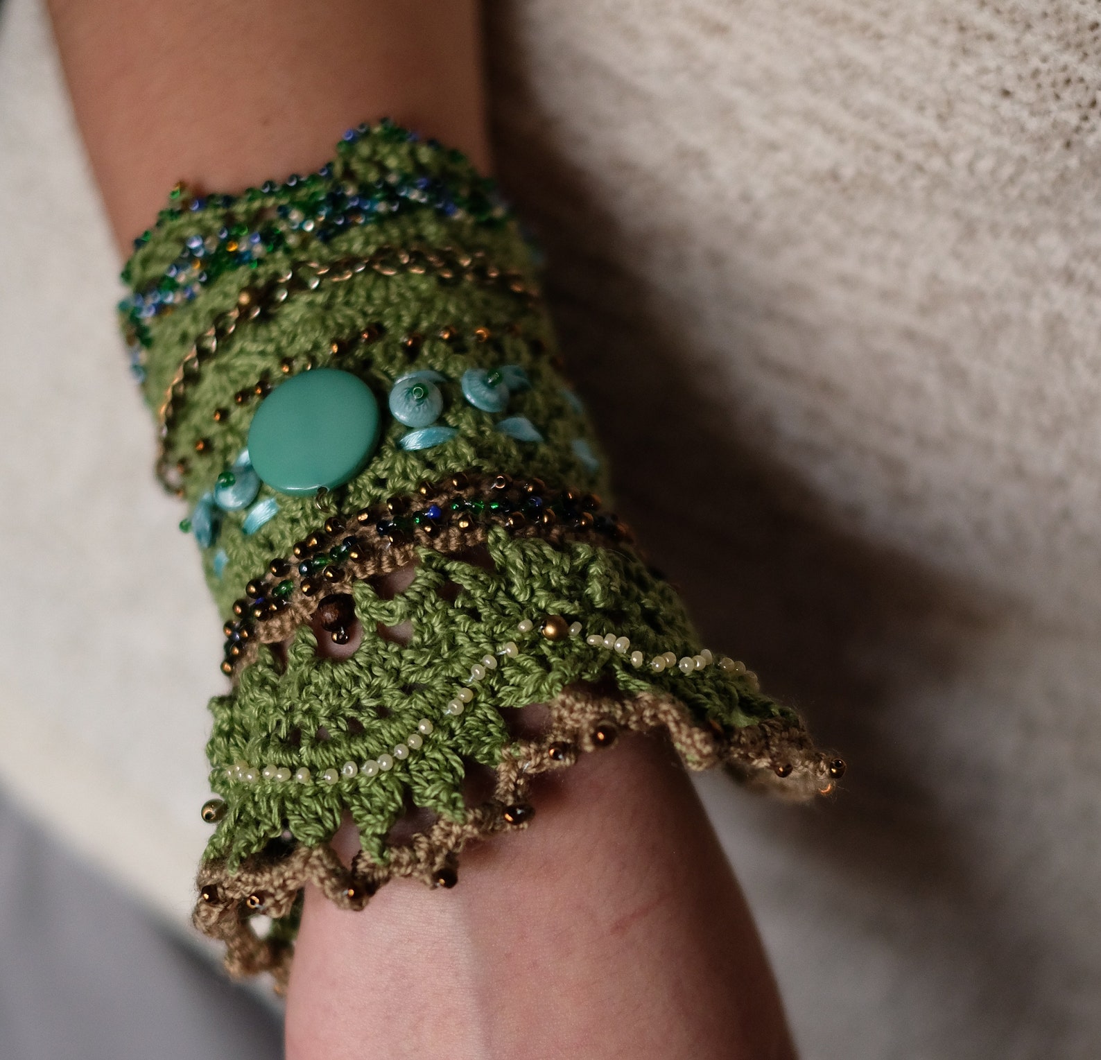 Green knitted bracelet is a decoration that will emphasize Etsy