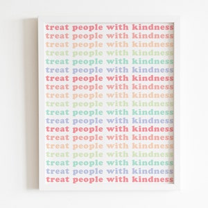 May include: A white framed print with the text "treat people with kindness" repeated 19 times in a rainbow of colors.