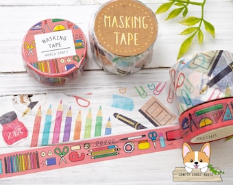 May include: Two rolls of pink and white washi tape with a school supplies theme. The tape features pencils, scissors, rulers, and other school supplies. The tape is labeled "Masking Tape" and "World Craft".