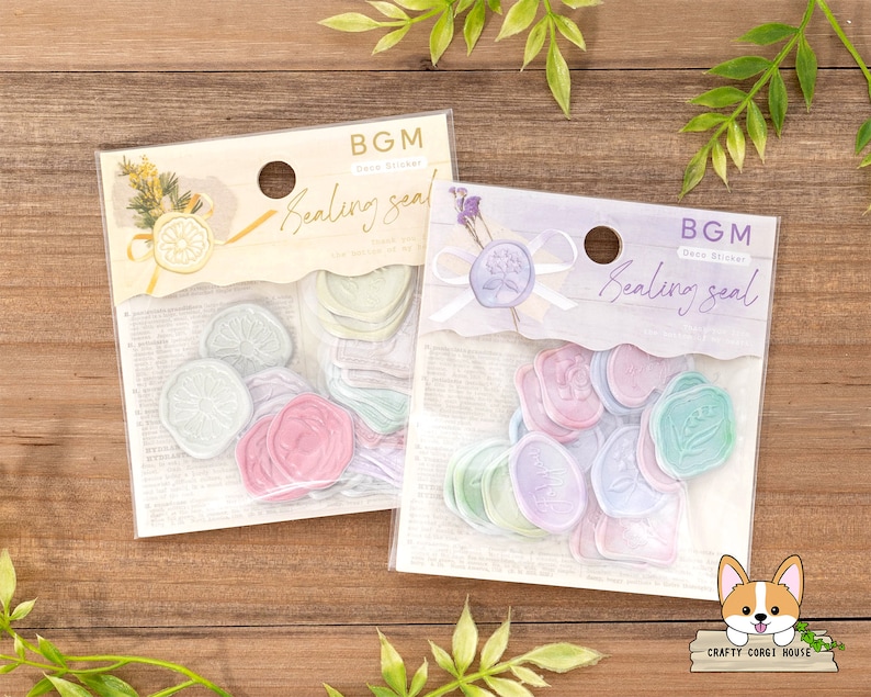 May include: Two packages of pastel colored wax sealing stickers. The stickers are in the shape of a circle and have different designs. The packages are labeled "BGM Deco Sticker Sealing Seal".